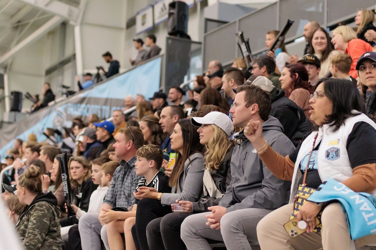 Supporters in the stands at a Detroit Metro FC match