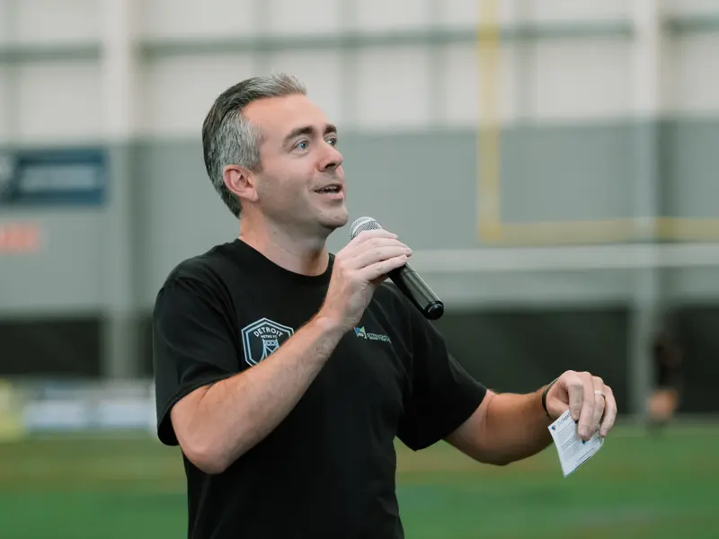 A speaker addresses the crowd on matchday