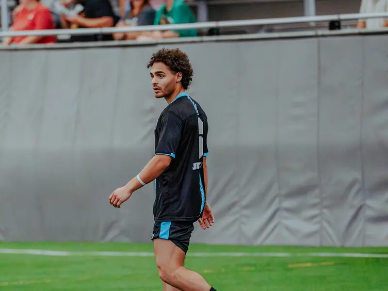 A Detroit Metro FC player walks the pitch